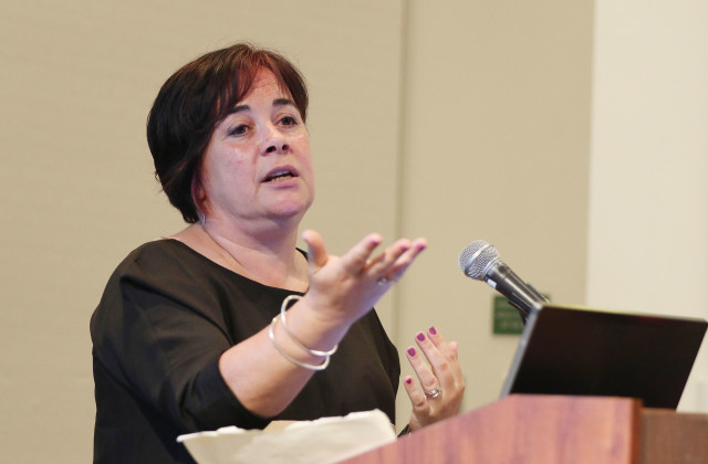 Mirella von Lindenfels, director of MarineSafe, discusses the harmful effects of personal care products that contain oxybenzone and other chemicals Thursday at the International Coral Reef Symposium.